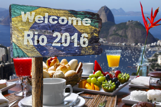 Welcome sign to Rio de Janeiro, near a breakfeast table 