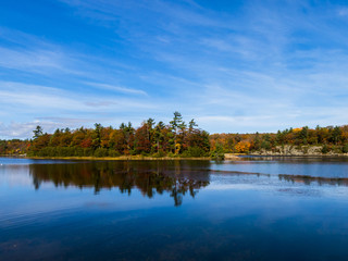 Fototapeta na wymiar Scenic Autumn Colors Reflected in the water