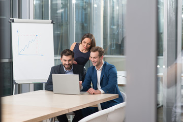 Skillful young colleagues are working in office