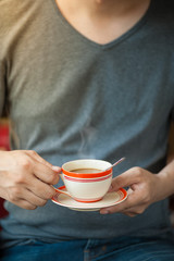Coffee cup in male hand