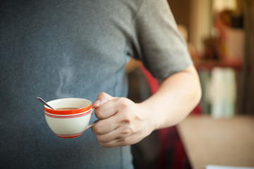 Coffee cup in male hand