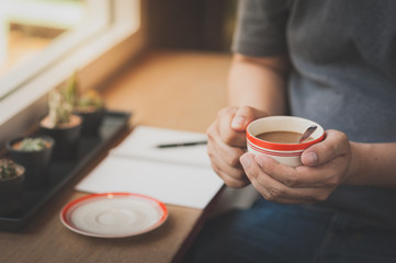 Coffee cup in male hand