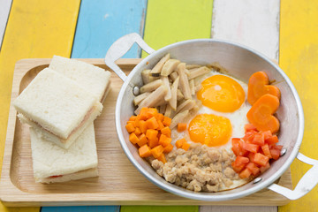 Pan fried eggs and sandwiches