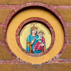 Mosaic icon of the Madonna della Consolata on the wall