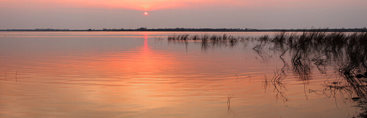 Sunset on the river during floods