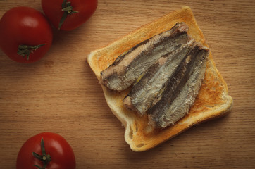 Canned sardines on toasted slice of bread