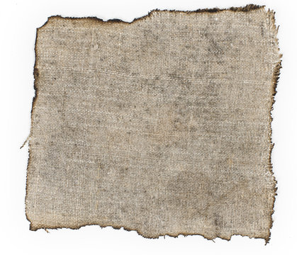 old burnt burlap on a white surface