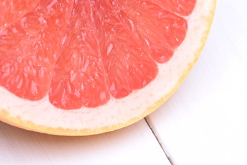 Red grapefruit on a wooden background