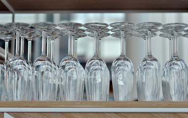 Rows of the empty Wine Glasses on the shelf