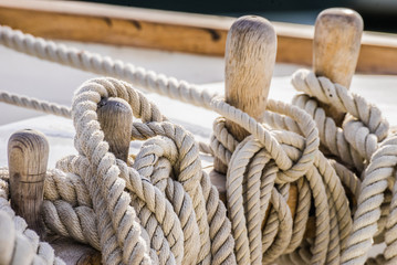 Ropes moored on a old sailing boat - obrazy, fototapety, plakaty