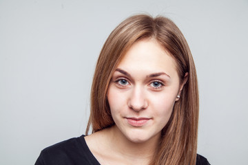 Attractive woman with black t-shirt isolated on a over white background