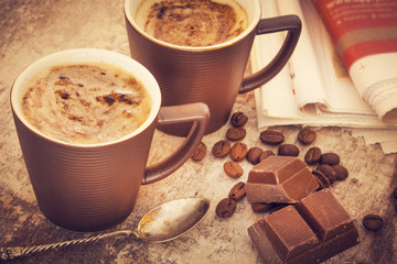 Cups of coffee on wooden