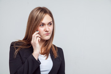 Beautiful smiling business woman talking on the phone