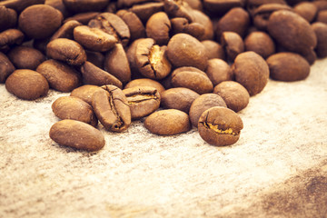 Coffee beans on wooden background