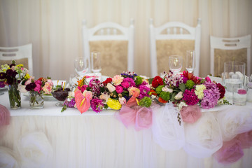 Beautifuly decorated wedding reception table covered with fresh