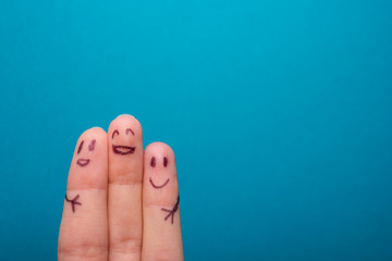three smiling fingers that are very happy to be friends - obrazy, fototapety, plakaty