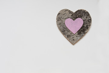 Pink Heart on Wooden heart On White Background