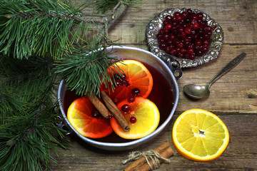 Mulled wine with cinnamon and a cowberry