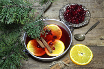 Mulled wine with cinnamon and a cowberry