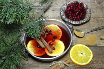 Mulled wine with cinnamon and a cowberry