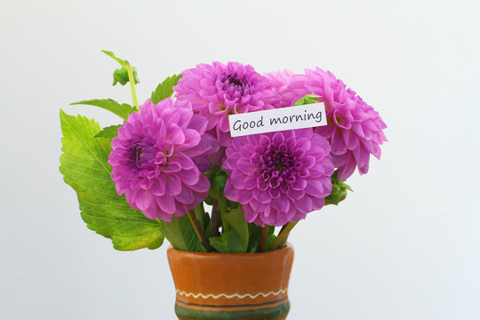Good morning card with pink dahlia bouquet in clay flower vase

