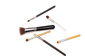 Assorted make up brushes on white background