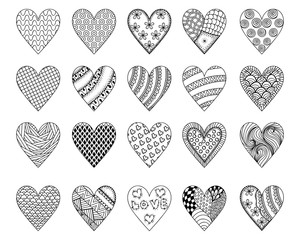 Hand drawn ethnic ornamental patterned hearts with love in doodl