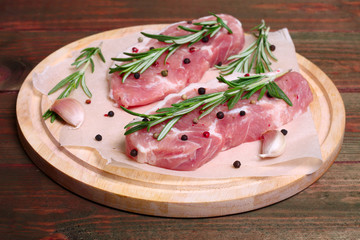 fresh raw meat with rosemary and pepper