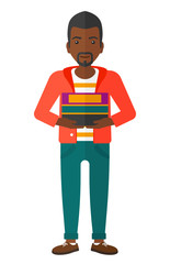 Man holding pile of books.
