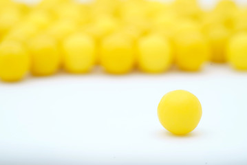 vitamin tablets and faceless smiles on a white background