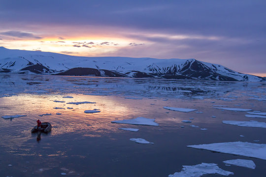Arctic Glow reflecting in Whalers Bay, Deception Island, Antarct