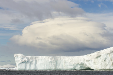 Tabular iceberg with linticular cloud, Antarctica