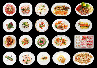 Set of various appetizers on black background
