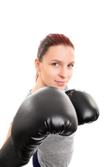 Smiling beautiful young girl with boxing gloves