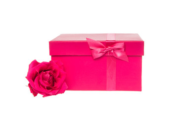 Pink present box with bow and pink single rose on a white background
