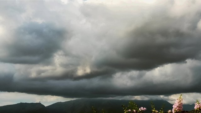 Time lapse of stormy weather over a tropical capital city.
