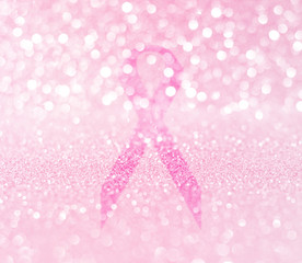 breast cancer awareness pink ribbon on glitter bokeh background