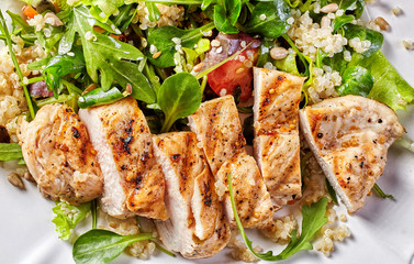 Fototapeta Quinoa and vegetable salad with grilled chicken obraz