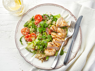 Quinoa and vegetable salad and grilled chicken