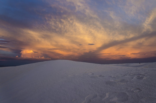 A beautiful sunset with cloudy sky at White Sand Dunes National Monument.