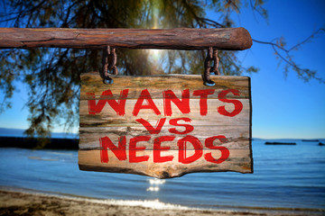 Wants vs needs motivational phrase sign