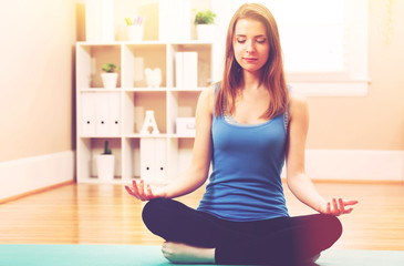 Young woman practicing meditation