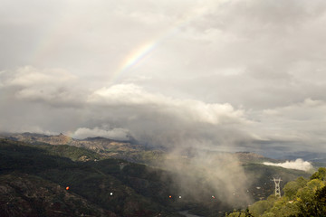Rainbow and Low Cloud on the Valley