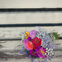 bouquet tender flowers on the wooden background