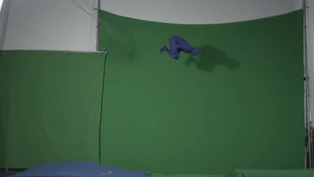 Man swings from rope, triple backflips onto landing pad