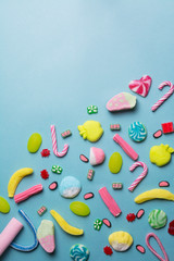 mixed collection of colorful candy, on blue background