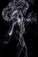 Obraz premium White smoke on black background.