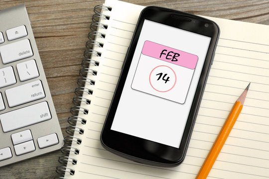 mobile phone showing feb 14 calendar, Valentine's day