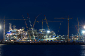 Fototapeta na wymiar Industrial landscape with cranes