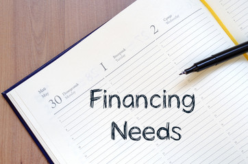 Financing needs write on notebook